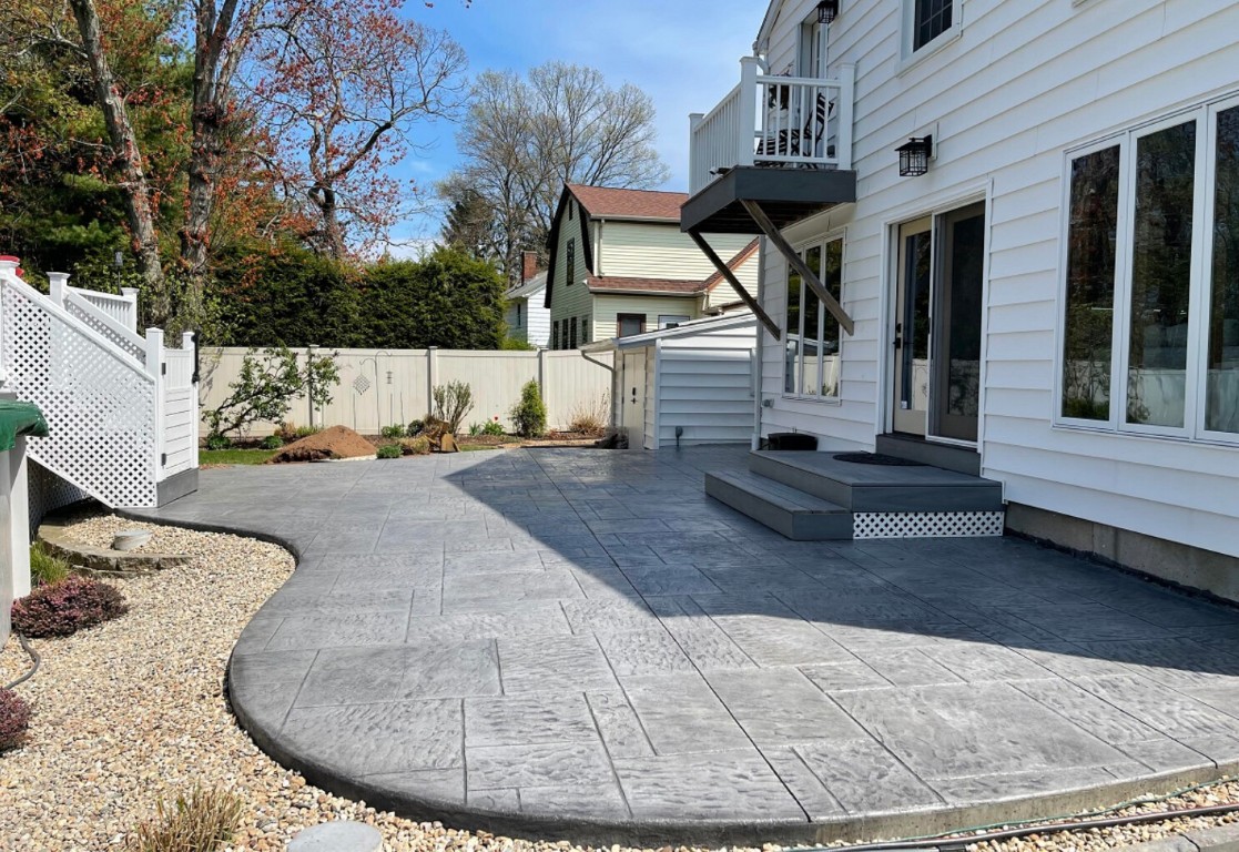 Elegant gray stamped concrete patio with decorative pattern in Tustin, CA